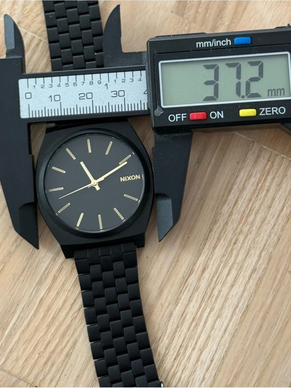 Nixon Minimal The Time Traveler Black Stainless Case Bracelet Gold Hands Markers